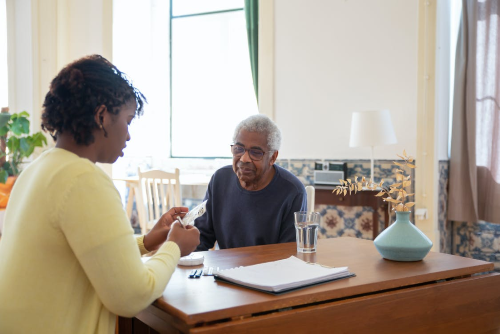 A caregiver preparing medicine for their patient.