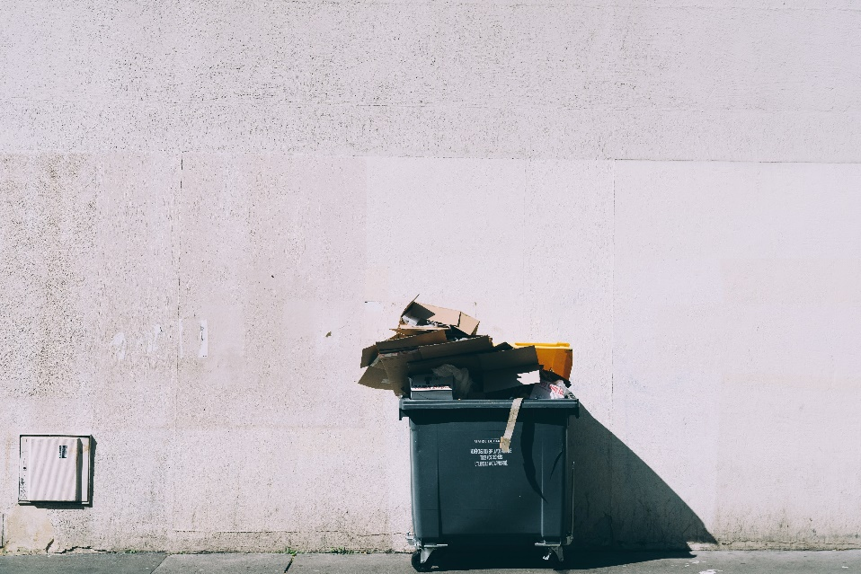 A garbage bin filled with different things. 