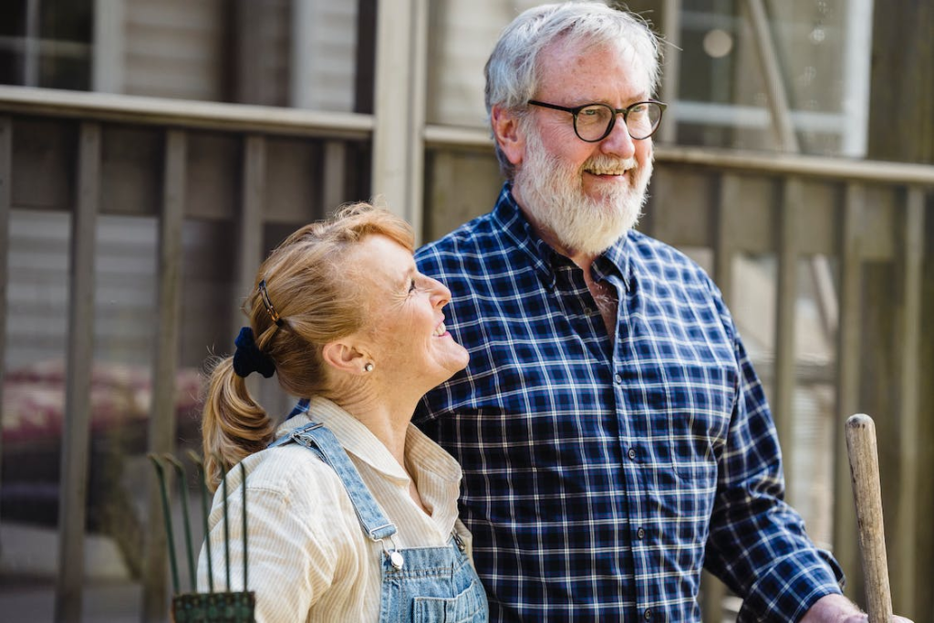 A senior couple smiling.