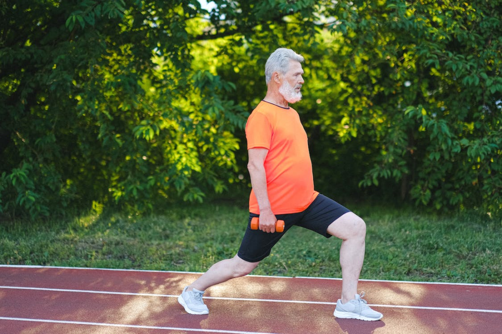 A senior doing light exercise with weights