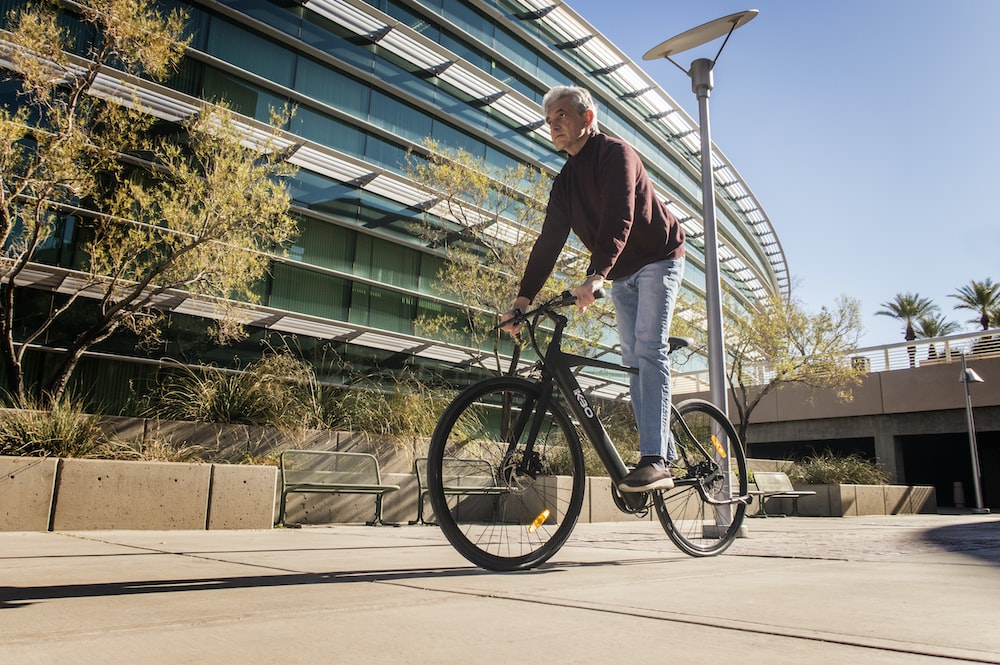 A man on a bicycle.