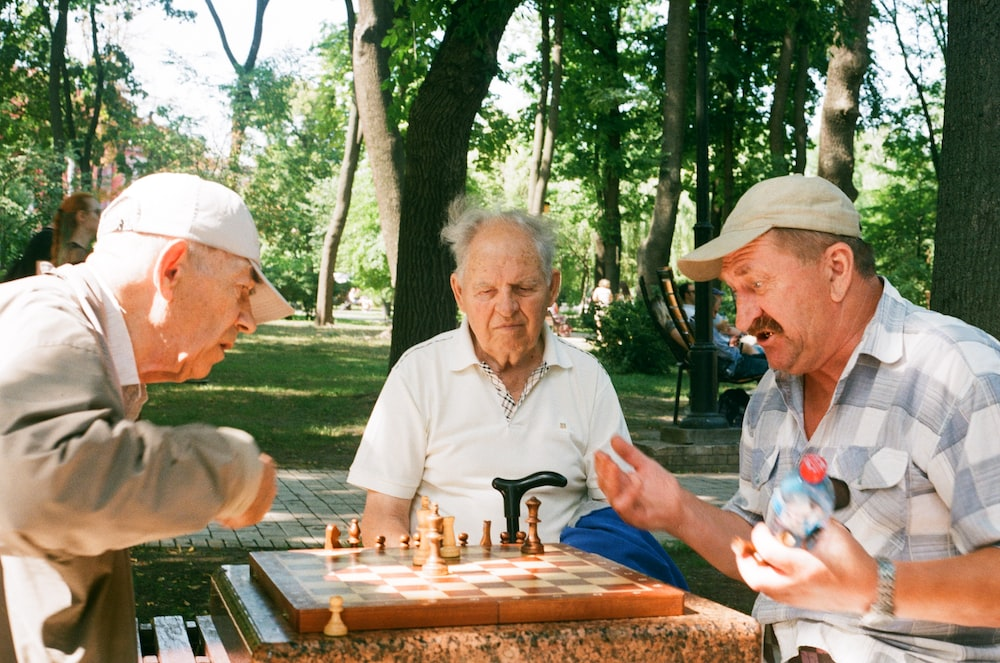  Three men sitting together.