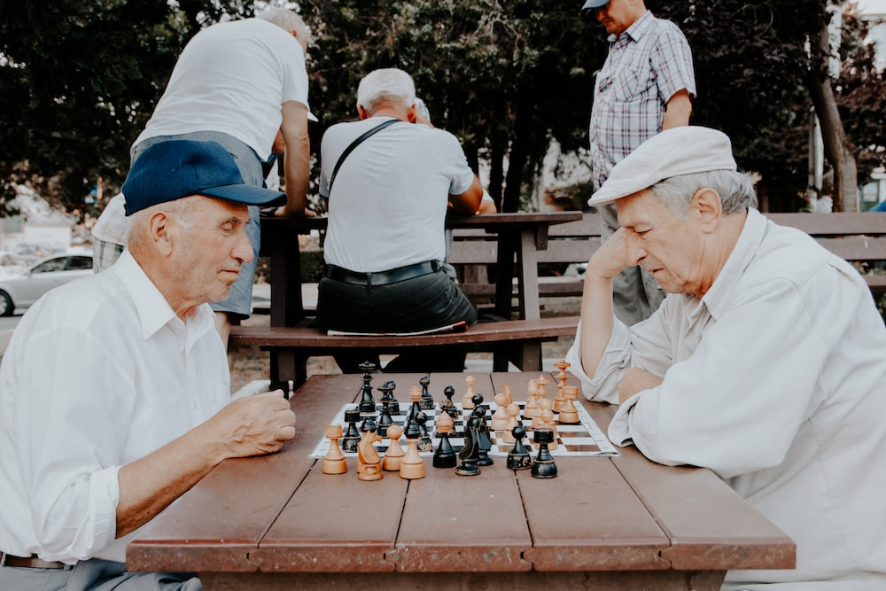 elderly men playing chess.