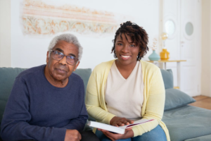 caregiver sitting with a man.