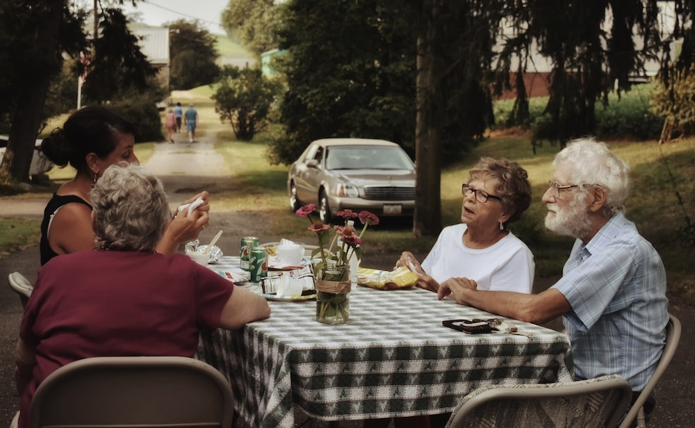 A group of senior friends talking to each other