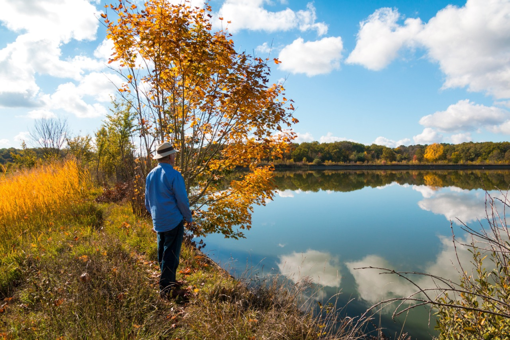 A senior fishing at a lake