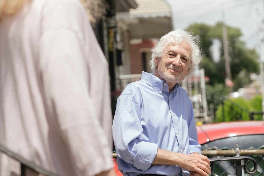 A senior smiling at someone