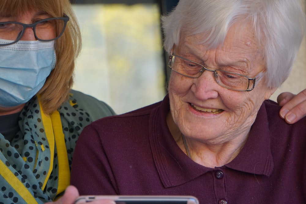 a senior looking at her phone. 