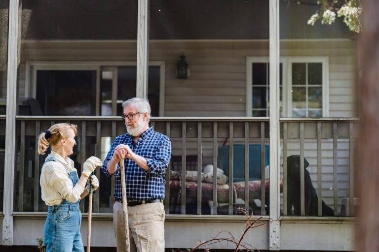 A senior couple gardening at a senior living community