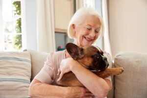 A happy senior with their dog