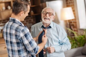 A caregiver and a happy a senior