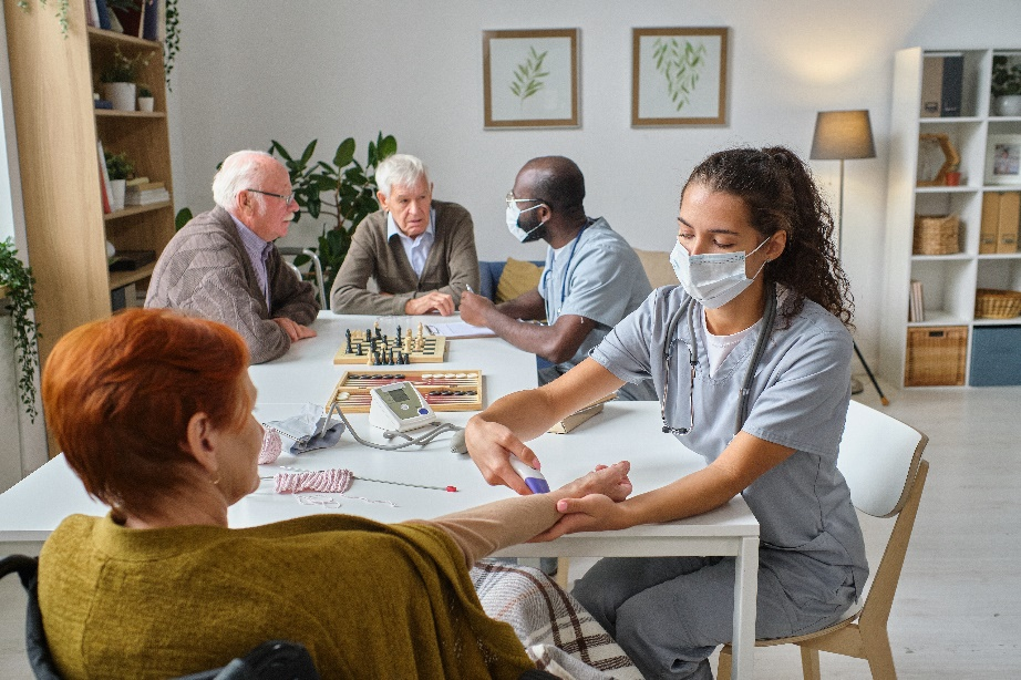 a group of seniors being attended by staff