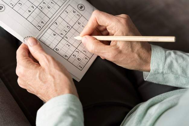 A senior filling out a game of sudoku