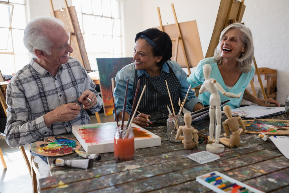 A group of seniors working on art projects assisted living community