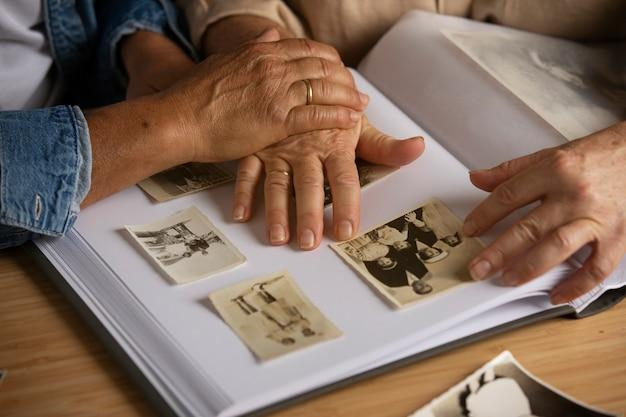  A person pasting photographs into an album