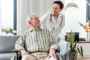 A senior with their caregiver at a memory care community