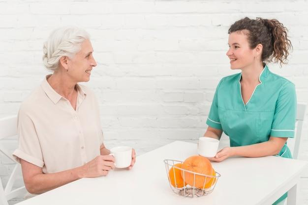 A senior discussing senior nutrition with their caregiver