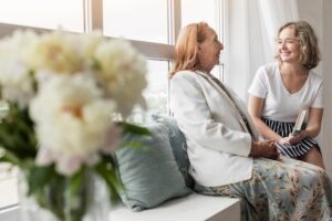 A senior with a caregiver at an assisted living community