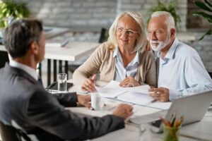 A senior couple talking to a senior living advisor