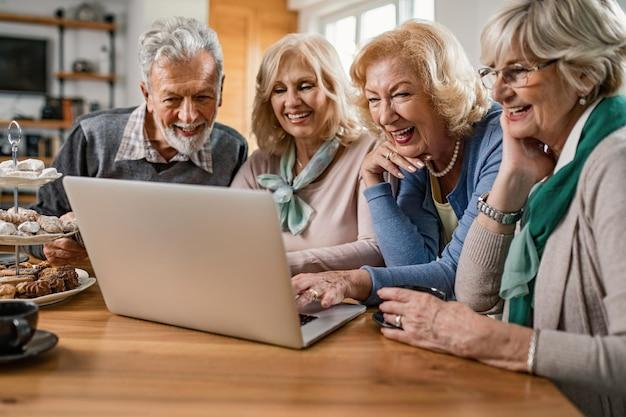 A senior couple talking to loved ones on videocall 