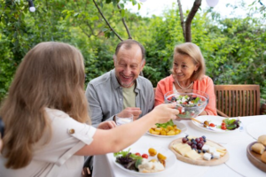 A senior couple having a healthy meal at an assisted living community