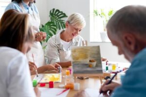 A group of seniors making paintings