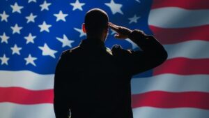 A person saluting the American flag