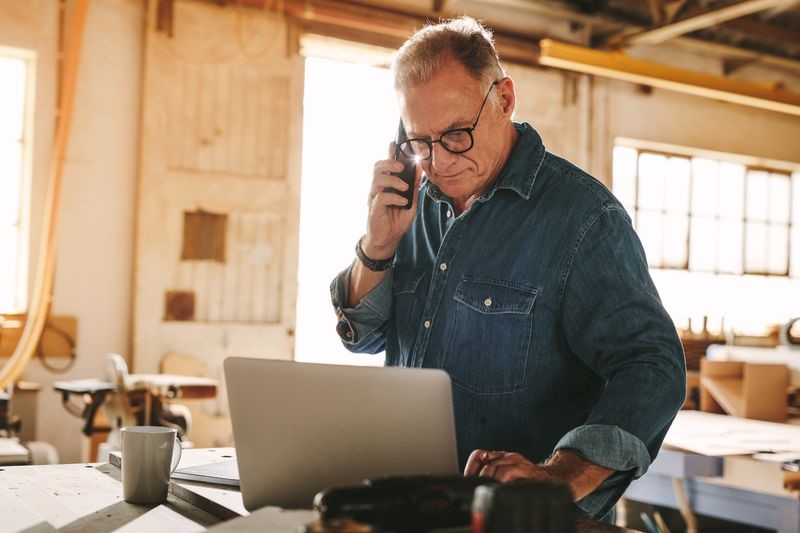 A senior using a laptop