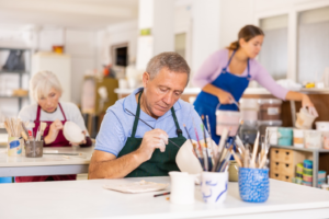 A senior making holiday crafts